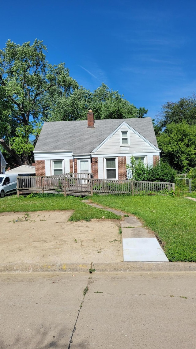 1109 Meadowbrooke St, Inkster, MI 48141 - bungalow with brick siding, a fenced front yard, and a chimney