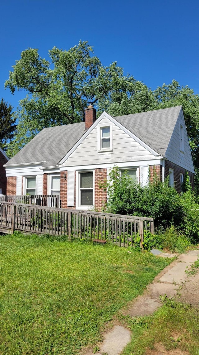 1109 Meadowbrooke St, Inkster, MI 48141 - bungalow-style house with brick siding, a chimney, and a front yard