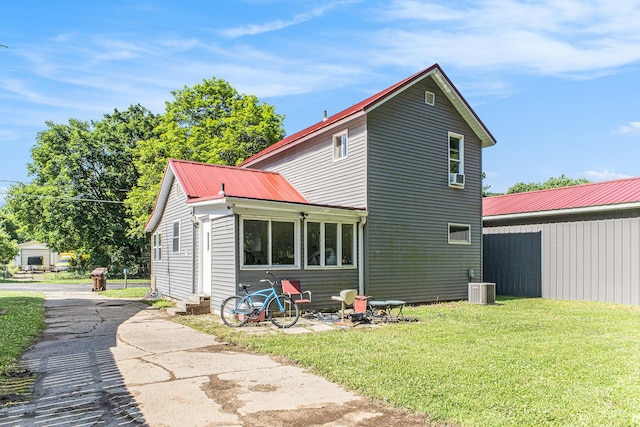 617 E Thorn St, Hastings, MI 49058 - back of property featuring a yard and a metal roof