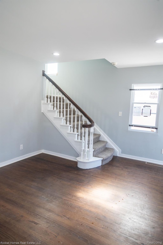 3926 Three Mile Dr, Detroit, MI 48224 - staircase with wood finished floors and recessed lighting