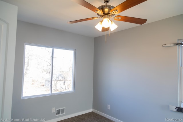 3926 Three Mile Dr, Detroit, MI 48224 - unfurnished room with a ceiling fan, plenty of natural light, and dark carpet