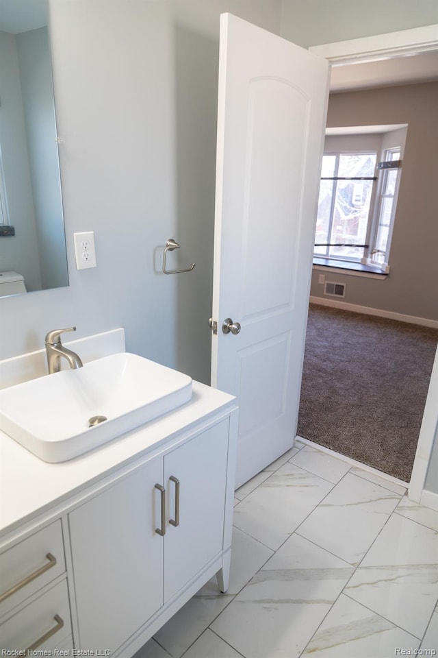 3926 Three Mile Dr, Detroit, MI 48224 - bathroom with vanity and marble look tiles