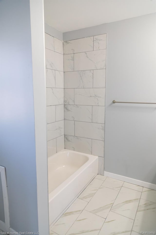 3926 Three Mile Dr, Detroit, MI 48224 - bathroom featuring marble look tile flooring and  shower combination