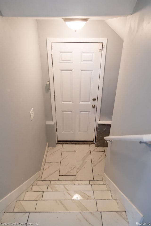 3926 Three Mile Dr, Detroit, MI 48224 - doorway with light marble finish flooring and baseboards