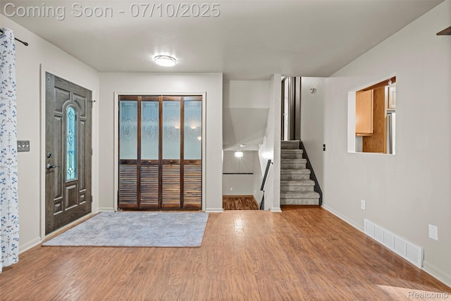 1560 Mercedes St, West Bloomfield, MI 48324 - foyer entrance featuring wood finished floors and stairs