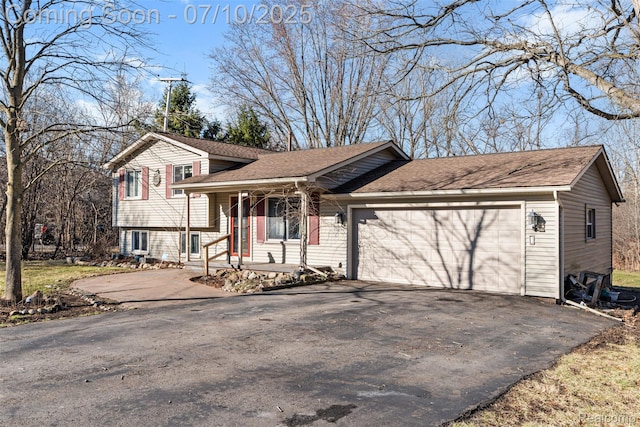 1560 Mercedes St, West Bloomfield, MI 48324 - tri-level home featuring asphalt driveway, a garage, and a shingled roof
