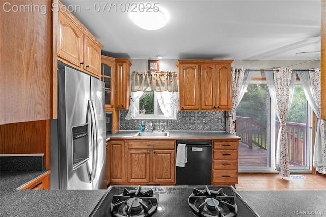 1560 Mercedes St, West Bloomfield, MI 48324 - kitchen featuring stainless steel fridge, black dishwasher, tasteful backsplash, cooktop, and brown cabinetry