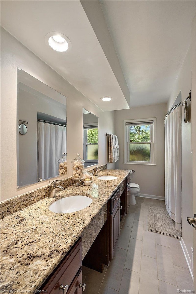 4151 Seminole Dr, Royal Oak, MI 48073 - full bath featuring double vanity, tile patterned floors, and curtained shower