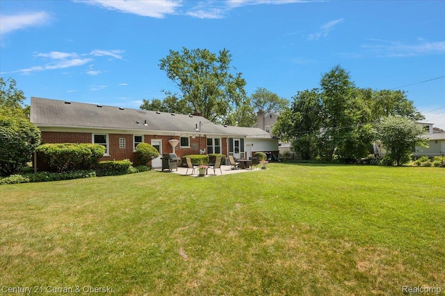 4151 Seminole Dr, Royal Oak, MI 48073 - rear view of house featuring a patio, a lawn, and brick siding