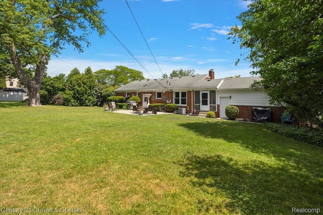 4151 Seminole Dr, Royal Oak, MI 48073 - rear view of property featuring a patio area, a lawn, entry steps, brick siding, and a chimney