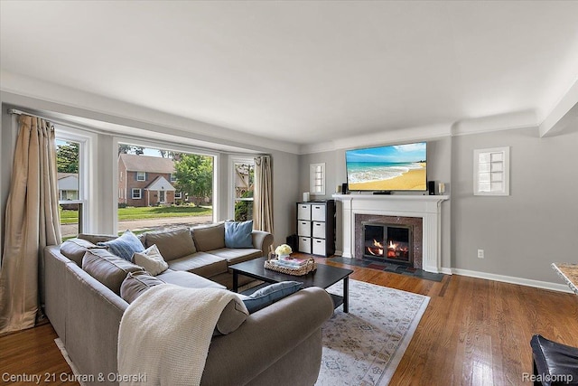 4151 Seminole Dr, Royal Oak, MI 48073 - living area featuring plenty of natural light, a fireplace with flush hearth, and wood finished floors