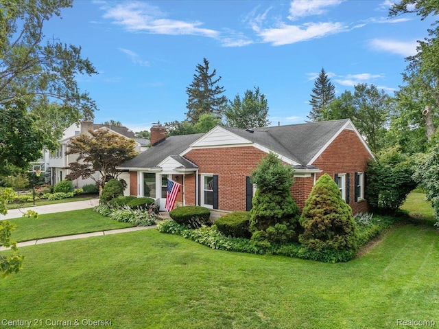 4151 Seminole Dr, Royal Oak, MI 48073 - view of front facade with brick siding, concrete driveway, a front yard, and an attached garage