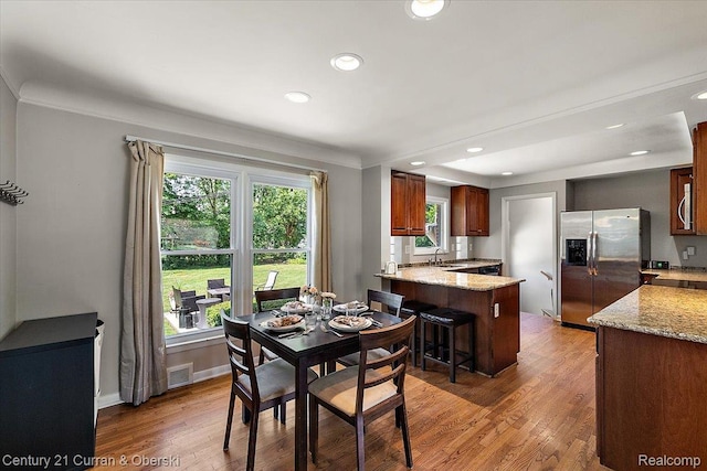 4151 Seminole Dr, Royal Oak, MI 48073 - dining room featuring light wood-type flooring, recessed lighting, and crown molding