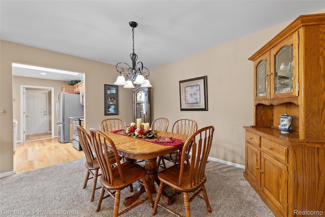 50323 Highpoint Ct, Macomb, MI 48044 - dining room featuring light carpet and a chandelier