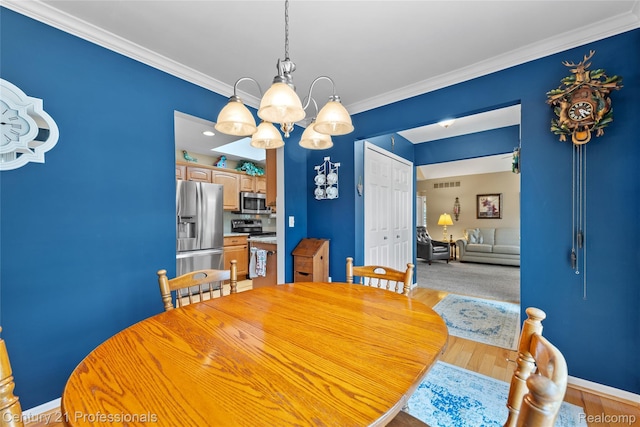 50323 Highpoint Ct, Macomb, MI 48044 - dining area with a chandelier, crown molding, and wood finished floors