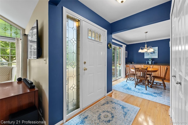 50323 Highpoint Ct, Macomb, MI 48044 - entryway with hardwood / wood-style floors, plenty of natural light, and a chandelier
