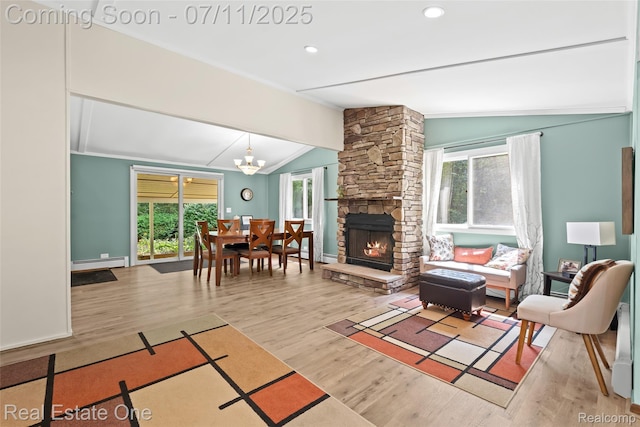 4217 Link Ave, Brighton, MI 48114 - living area with lofted ceiling, baseboard heating, wood finished floors, a fireplace, and a chandelier