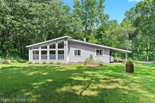 4217 Link Ave, Brighton, MI 48114 - view of front of property with a front lawn and a carport
