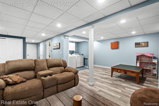 4217 Link Ave, Brighton, MI 48114 - living area featuring separate washer and dryer, wood finished floors, and a drop ceiling