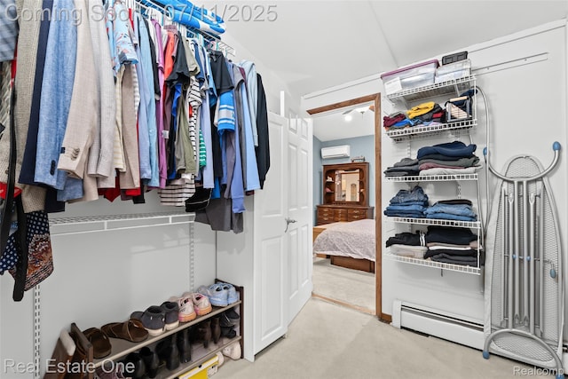 4217 Link Ave, Brighton, MI 48114 - walk in closet with a wall mounted AC, carpet floors, and a baseboard heating unit