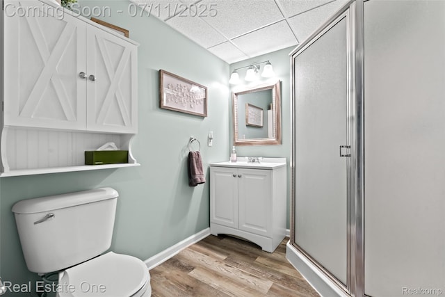 4217 Link Ave, Brighton, MI 48114 - bathroom with a drop ceiling, vanity, a stall shower, and wood finished floors