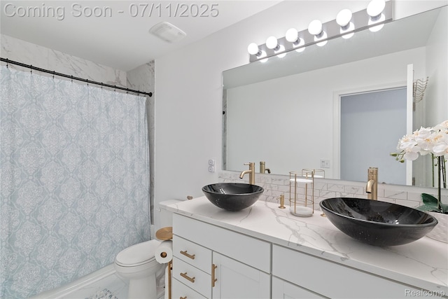 6649 Maplelawn Dr, Ypsilanti, MI 48197 - full bath featuring double vanity and marble look tiles