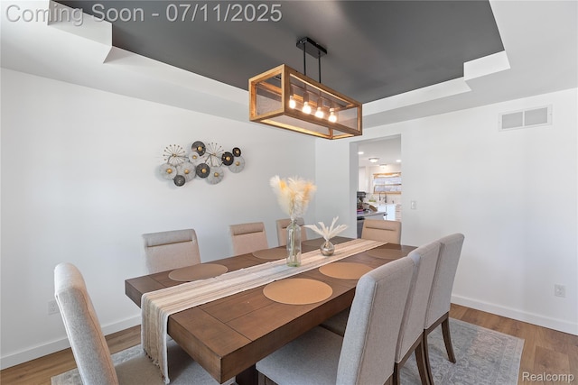 6649 Maplelawn Dr, Ypsilanti, MI 48197 - dining area with a raised ceiling and light wood finished floors