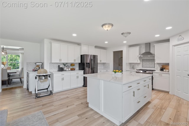6649 Maplelawn Dr, Ypsilanti, MI 48197 - kitchen featuring wall chimney exhaust hood, stainless steel refrigerator with ice dispenser, decorative backsplash, light wood-style floors, and recessed lighting