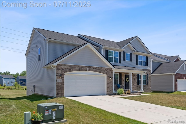 6649 Maplelawn Dr, Ypsilanti, MI 48197 - craftsman inspired home featuring an attached garage, a front lawn, driveway, and covered porch