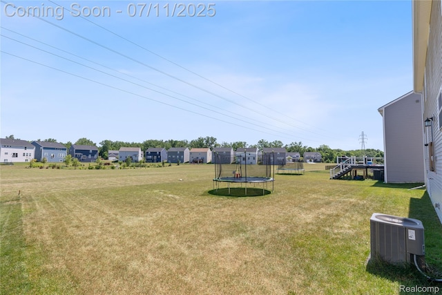 6649 Maplelawn Dr, Ypsilanti, MI 48197 - view of green lawn with a trampoline and a residential view