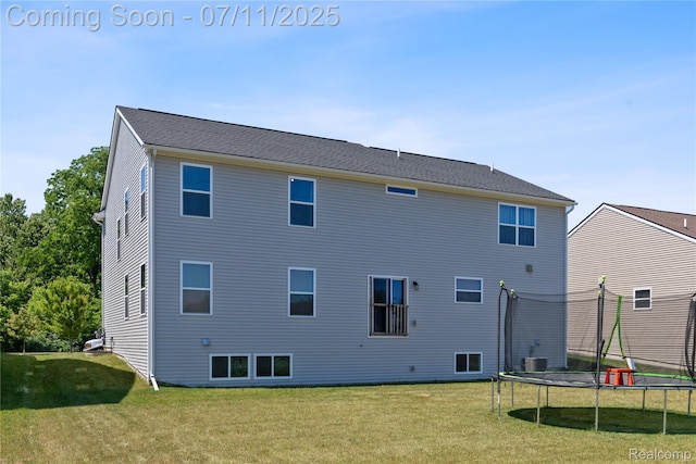 6649 Maplelawn Dr, Ypsilanti, MI 48197 - back of property featuring a trampoline and a yard