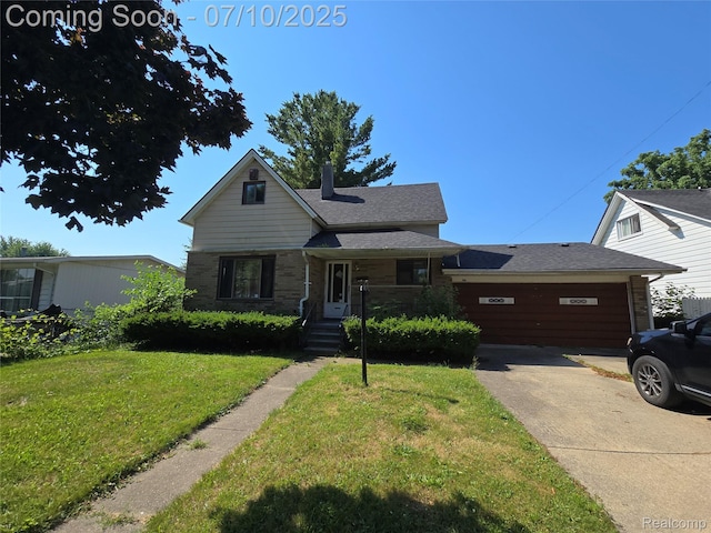 46 Michigan St, Mount Clemens, MI 48043 - view of front of property with concrete driveway, a front yard, and brick siding