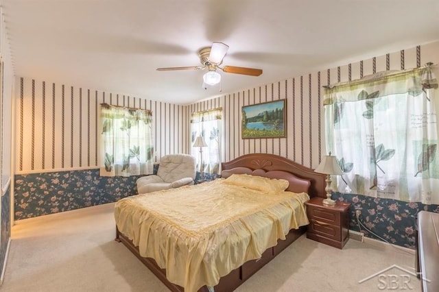 595 Stoneham Rd, Saginaw, MI 48638 - carpeted bedroom with wallpapered walls and a ceiling fan