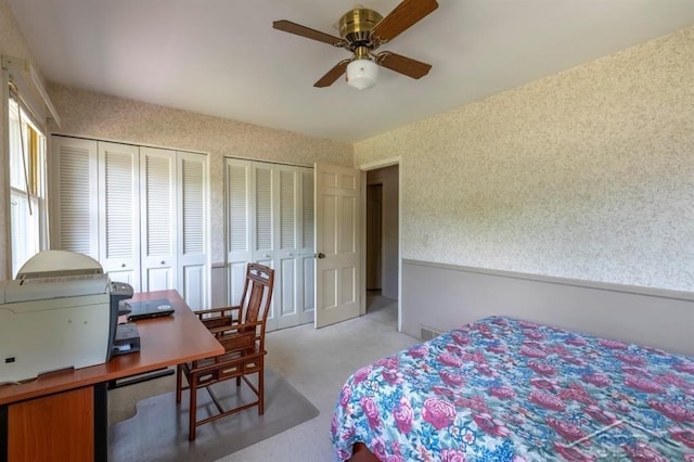 595 Stoneham Rd, Saginaw, MI 48638 - bedroom featuring multiple closets, a desk, carpet floors, and ceiling fan
