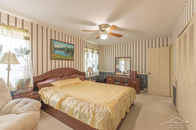 595 Stoneham Rd, Saginaw, MI 48638 - bedroom featuring wallpapered walls, light colored carpet, a closet, and a ceiling fan
