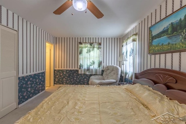 595 Stoneham Rd, Saginaw, MI 48638 - carpeted bedroom with wallpapered walls and a ceiling fan
