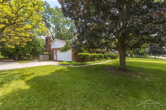 595 Stoneham Rd, Saginaw, MI 48638 - view of front facade featuring brick siding, driveway, a chimney, and an attached garage