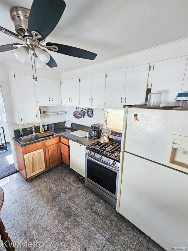 4010 Stolzenfeld Ave, Warren, MI 48091 - kitchen featuring white appliances, a ceiling fan, dark countertops, granite floors, and white cabinets