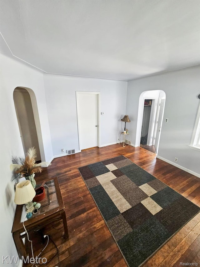 4010 Stolzenfeld Ave, Warren, MI 48091 - living room featuring arched walkways and hardwood / wood-style floors