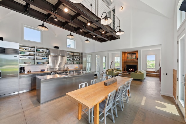 15337 Pardee Rd, Galien, MI 49113 - dining room with a towering ceiling, beamed ceiling, and a fireplace