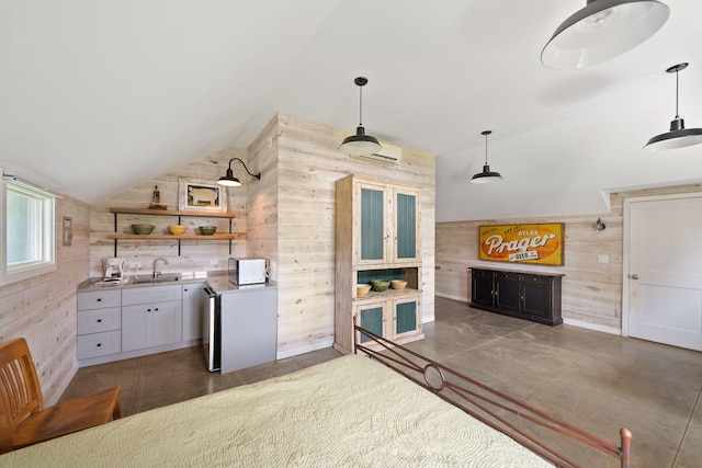 15337 Pardee Rd, Galien, MI 49113 - kitchen featuring lofted ceiling, wooden walls, open shelves, light countertops, and decorative light fixtures