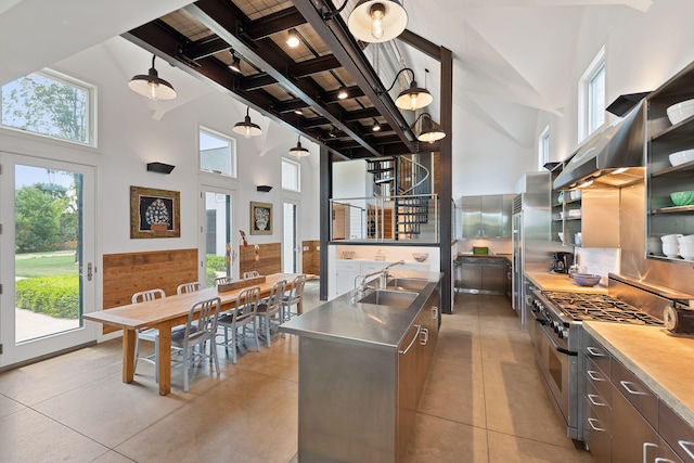 15337 Pardee Rd, Galien, MI 49113 - kitchen featuring stainless steel countertops, double oven range, beamed ceiling, plenty of natural light, and a towering ceiling
