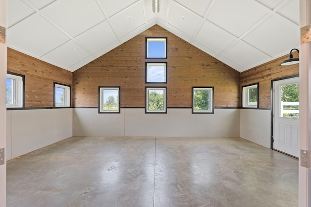 15337 Pardee Rd, Galien, MI 49113 - spare room with concrete floors, lofted ceiling, and wooden walls