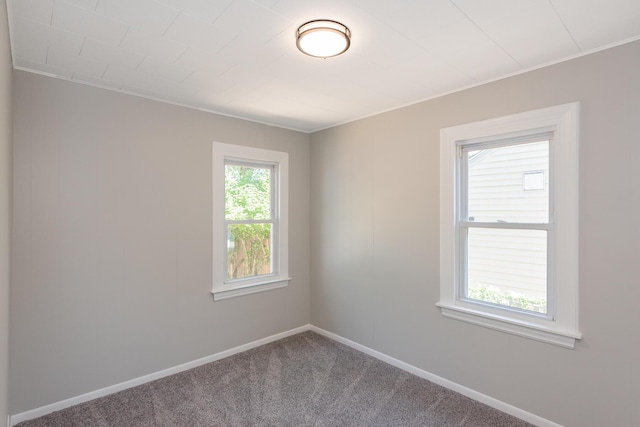 2931 Eastland Rd, Muskegon, MI 49441 - spare room featuring carpet floors and baseboards