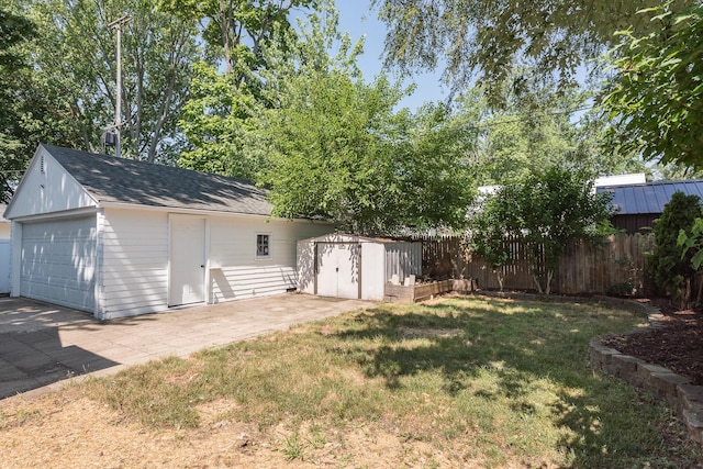 2931 Eastland Rd, Muskegon, MI 49441 - view of yard featuring a shed and a detached garage