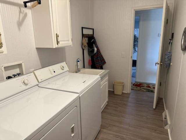 7878 Schooner Ln, Canadian Lakes, MI 49346 - laundry room with washer and dryer, cabinet space, and dark wood-style floors