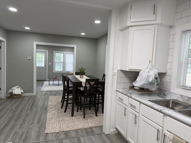 1008 Cooper Ave, Kalamazoo, MI 49048 - dining room with healthy amount of natural light, wood finished floors, and recessed lighting