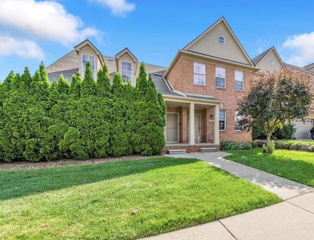 5196 Mesa Dr, Michigan, MI 48316 - view of front of home featuring brick siding, a front lawn, roof with shingles, and a porch