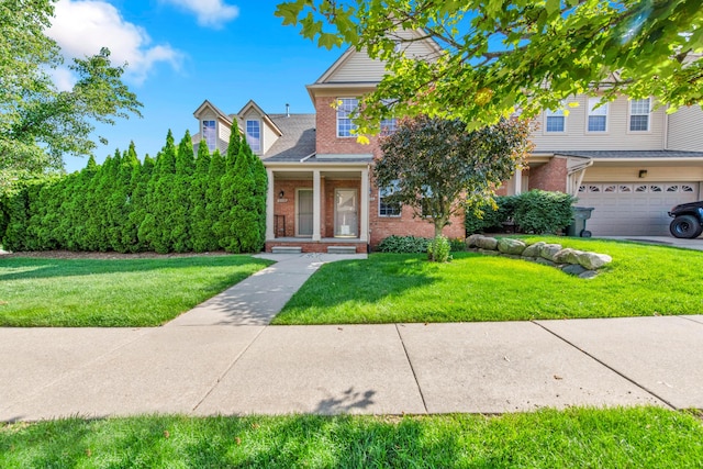 5196 Mesa Dr, Michigan, MI 48316 - view of front of property featuring brick siding, a front lawn, and an attached garage