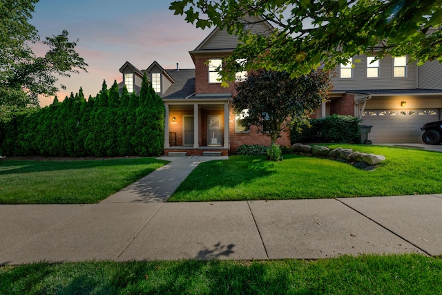 5196 Mesa Dr, Michigan, MI 48316 - view of front of house with brick siding, a front yard, and an attached garage